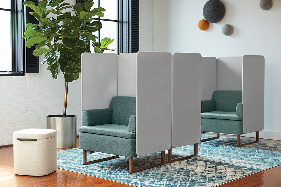 Private work pods with comfortable armchairs and acoustic panels, designed for focused work and small meetings. Office furniture solutions by Henricksen.