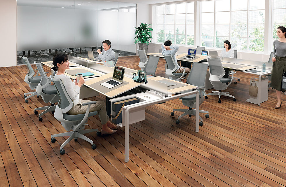 High-backed armchairs with built-in privacy screens, creating individual workspaces within an open office environment. Office furniture by Henricksen.