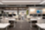 Modern and functional office space with open workstations and a comfortable lounge area. Office design by Henricksen.