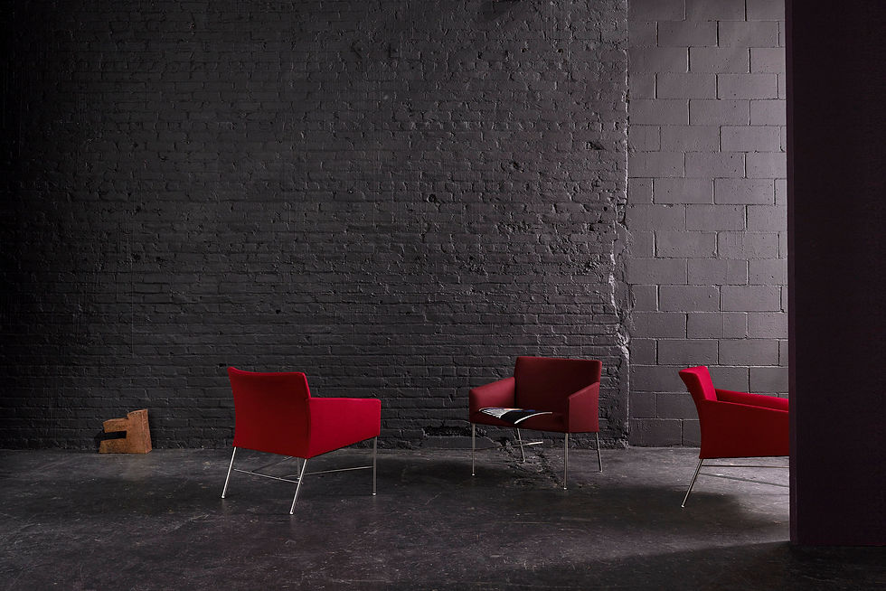Modern red office chairs with chrome legs, available through Henricksen's contract furniture services.