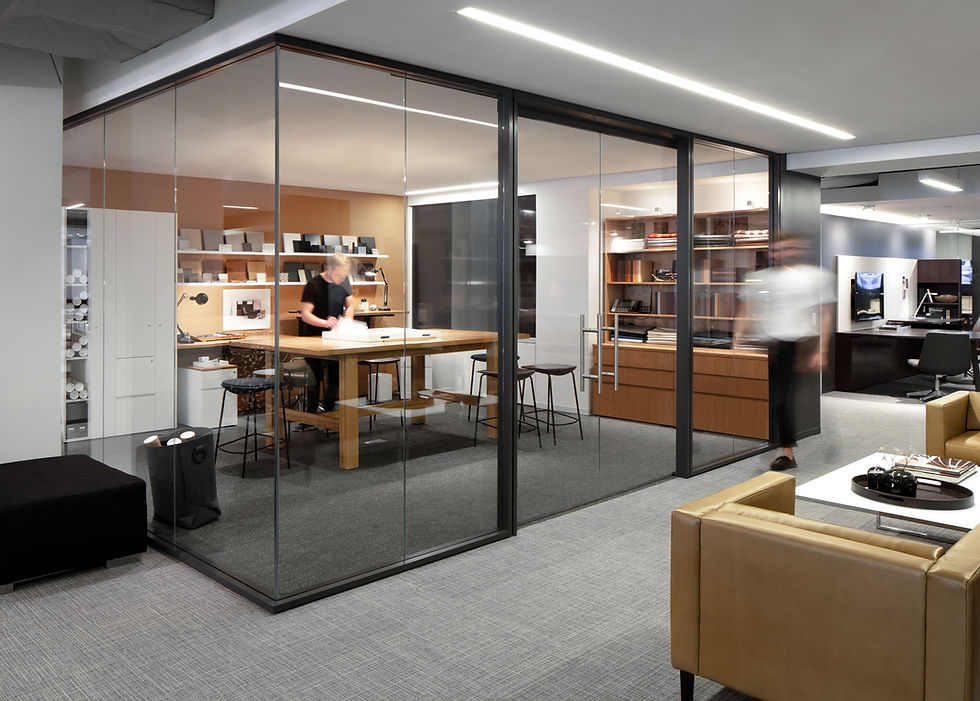 Modern office with private glass-walled offices, promoting transparency and collaboration. Office design by Henricksen.