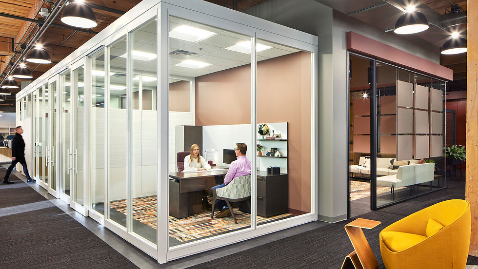 Modern office pod or private office space featuring Henricksen's contract furniture solutions, including a desk, ergonomic chair, and shelving.