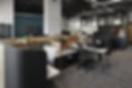 Modern office space showcasing Henricksen's office furniture solutions, including ergonomic chairs, collaborative workspaces, and contemporary desks.