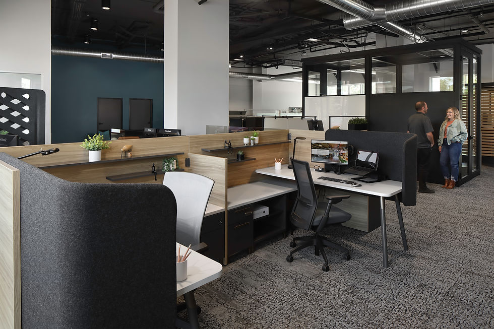 Modern office space showcasing Henricksen's office furniture solutions, including ergonomic chairs, collaborative workspaces, and contemporary desks.