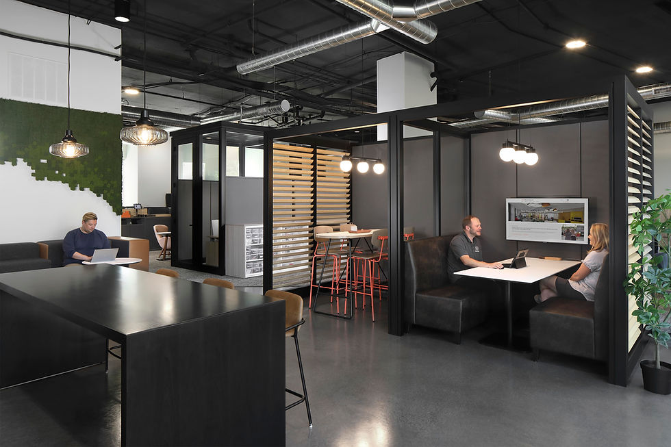 Contemporary office layout offering both private meeting spaces and areas for teamwork and informal gatherings. Office furniture solutions by Henricksen.